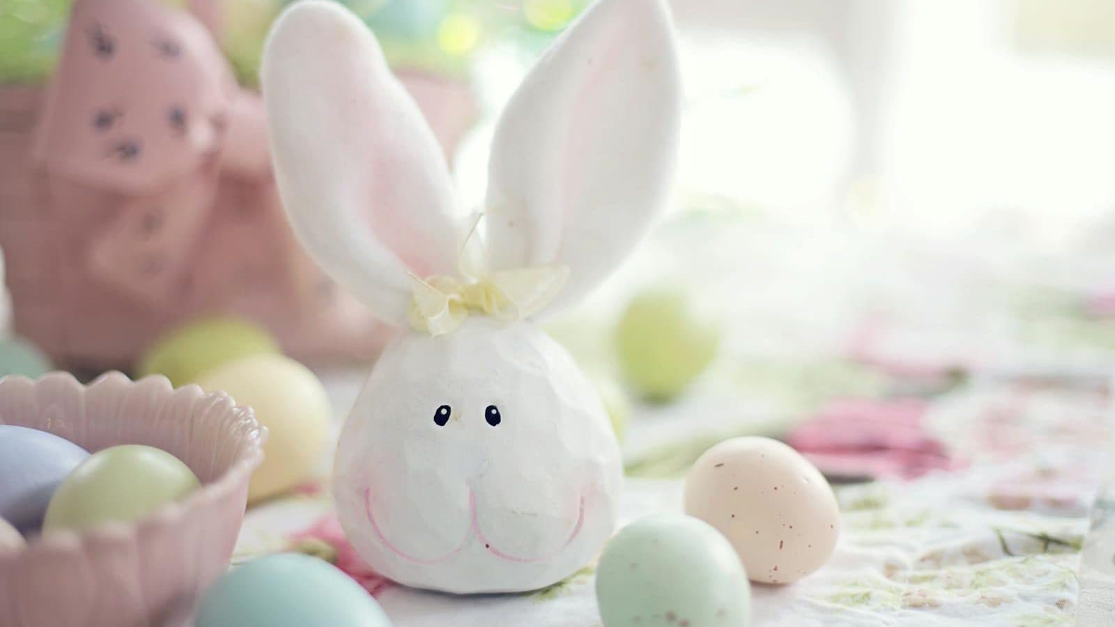 White Rabbit Figurine on White and Pink Floral Textile